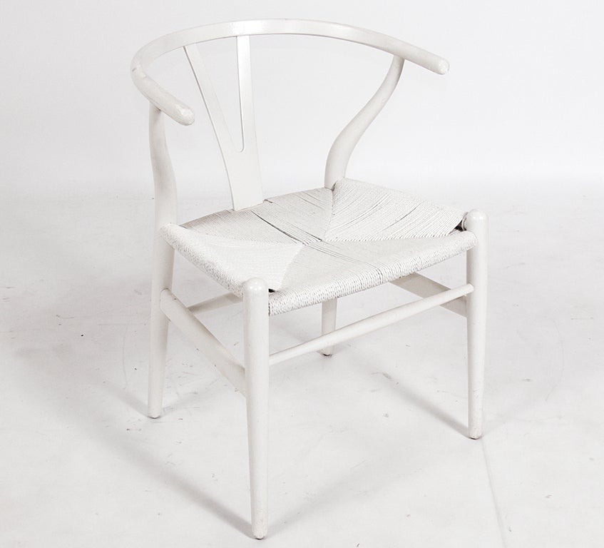 Set of Four Danish Modern Wishbone Dining Chairs, designed by Hans Wegner for Carl Hansen, Denmark, circa 1950's. These chairs have been fiinished in white lacquer at some point.