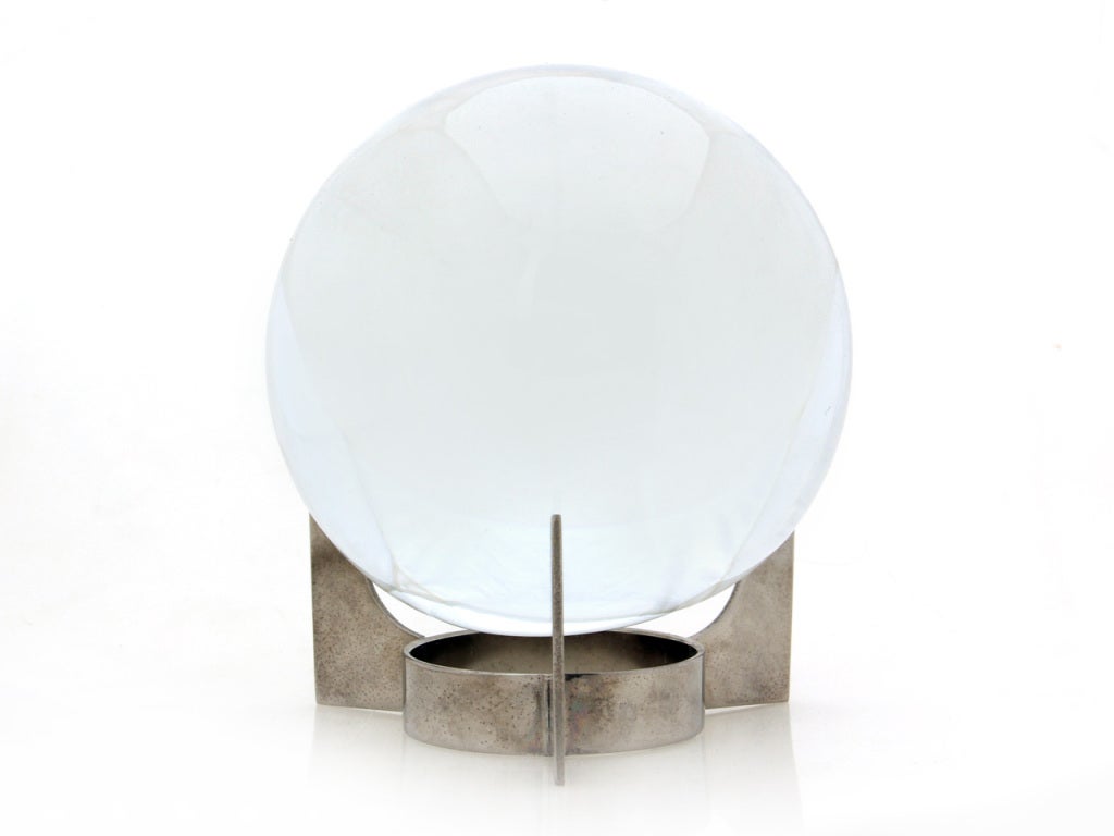 A crystal sphere and detachable chromed steel stand. Both pieces bear makers mark.
