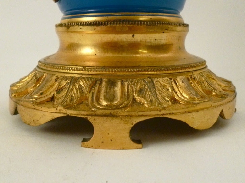 A Pair of French Louis Phillipe Blue Opaline Oil Lamps mounted with Ormolu.
The ormolu handles are in the form of vine leaves and grapes and the base and neck are finely chased with foliate mounts. With original oil burning mechanism.
Now adapted