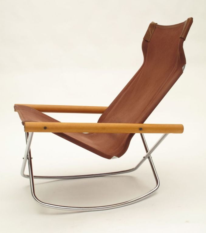 Very comfortable and practical folding rocking chair. Japanese designer Takeshi NII inspired by the simplicity and style of the directors chair and by the form and materials used in midcentury Danish design created this highly functional and
