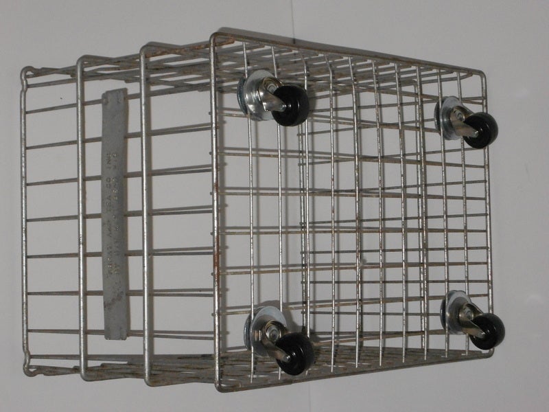 Galvanized steel wire storage bin was used originally to store and ship product for the A&P supermarket chain. Over-sized and heavy duty with added pivoting wheels that can support up to 320 pounds. Ideal storage unit for kid's toys, hallway shoes