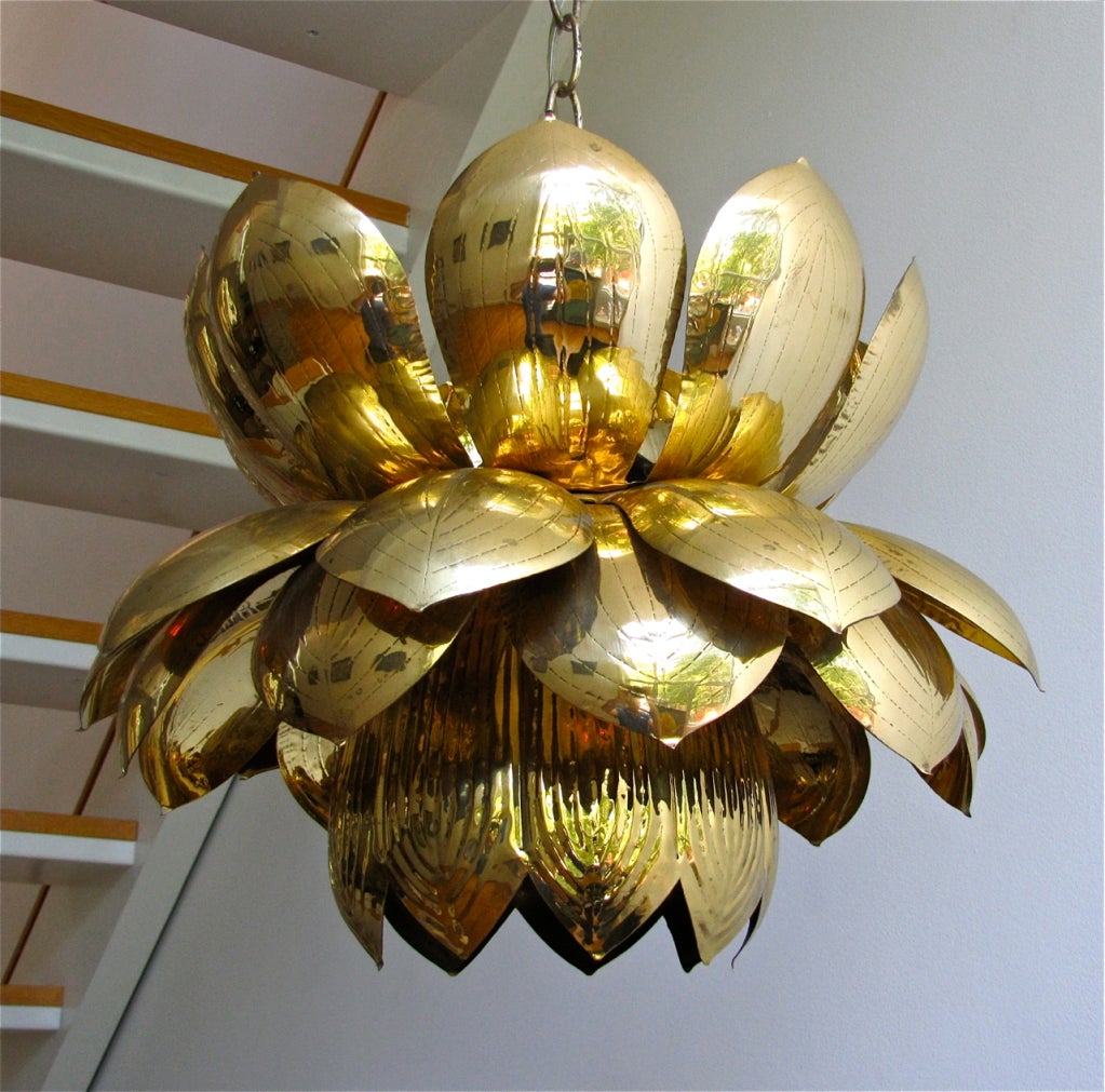 A large brass lotus blossom light pendant or chandelier with one lower light and 3 smaller lights on top. Original finish is in excellent condition with some sight spotting as shown.