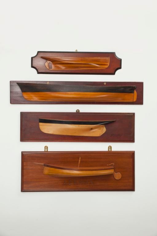 A collection of four superb polished wood half-hull ship builder's models, sold individually, ranging in size from 20 inches to 36 inches in length.