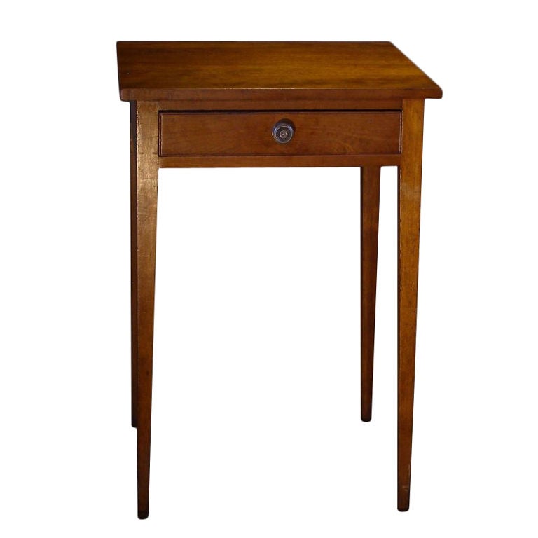 There is no ornamentation except a small bead on the drawer edge on this superbly proportioned one drawer side table. Black Cherry was the favorite substitute for mahogany in non-urban areas throughout the Northeast.