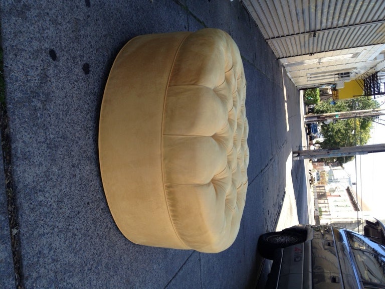Newly and fully refinished and upholstered large tufted rolling Hollywood Regency pouf, this Mid-Century decorative poof can double as an ottoman and it is most comfortable, please also visit to see more of our collection and inquire about rentals