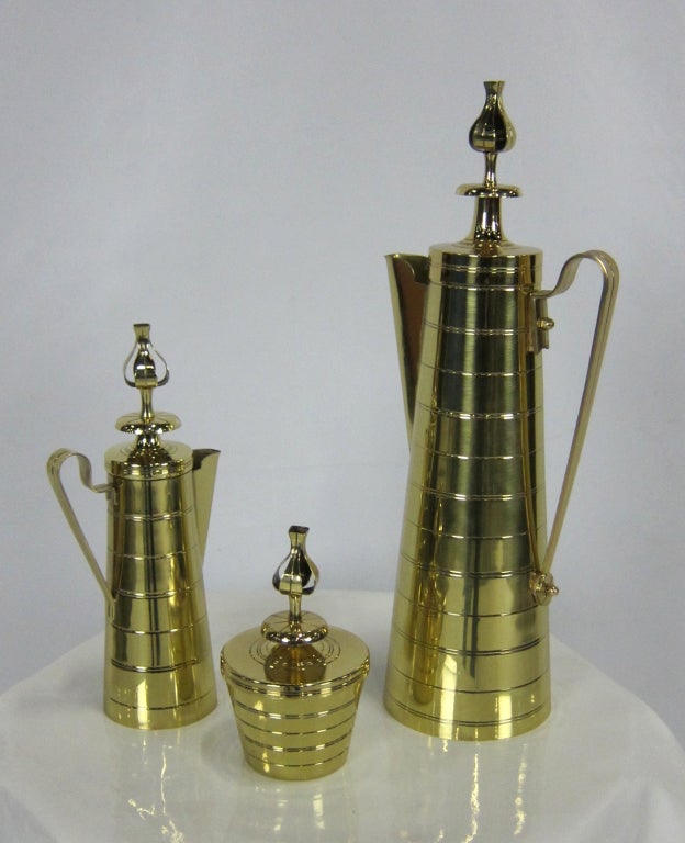 Brass Coffee Service by Tommi Parziger for Dorlyn Brass.  The set consists of a tall lidded carafe, creamer, and lidded sugar bowl.  The set has been professionally polished and lacquered.