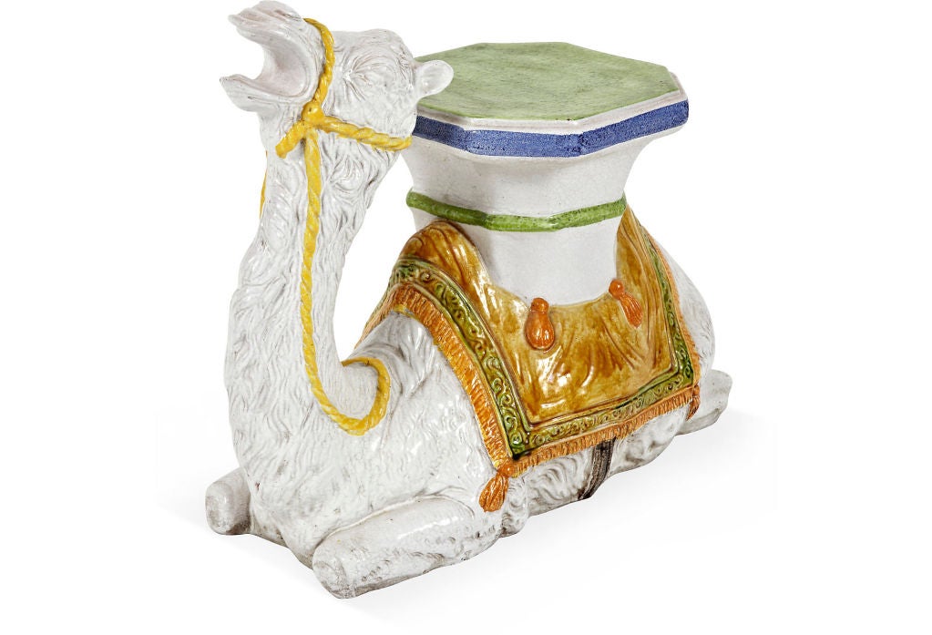 Charming 1950's polychrome glazed terracotta garden seat, Italy, 1950's, in the form of a recumbent camel.  Beautiful bright colors and crisp details, this stool is also prefect as a small pull-up drinks table.