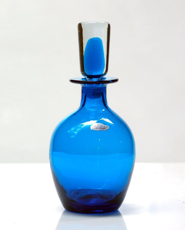 _____

(Items also available individually, please email to inquire.)

L to R:

1. ovoid decanter with cylindrical sommerso stopper, designed by John Nickerson in 1973.Design #7320 in Turquoise, pictured in the 1973 catalog.
Measures 12 inches