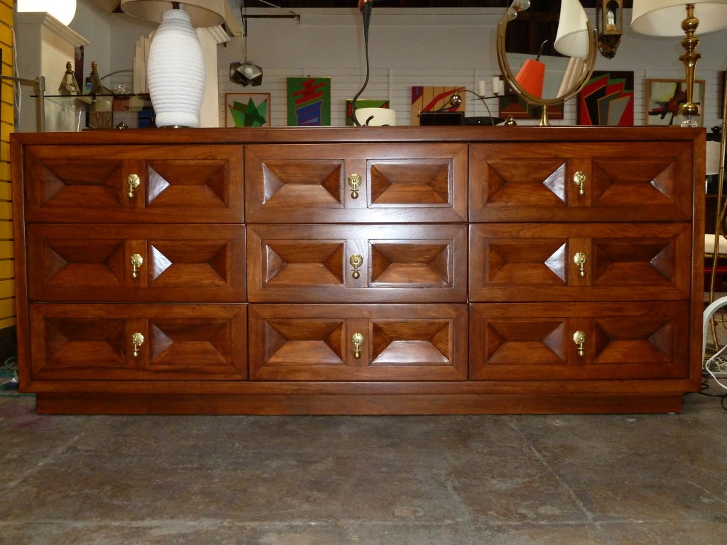 9 drawers walnut dresser with brass handles by American of Martinsville.
The 2 matching nightstands are available.