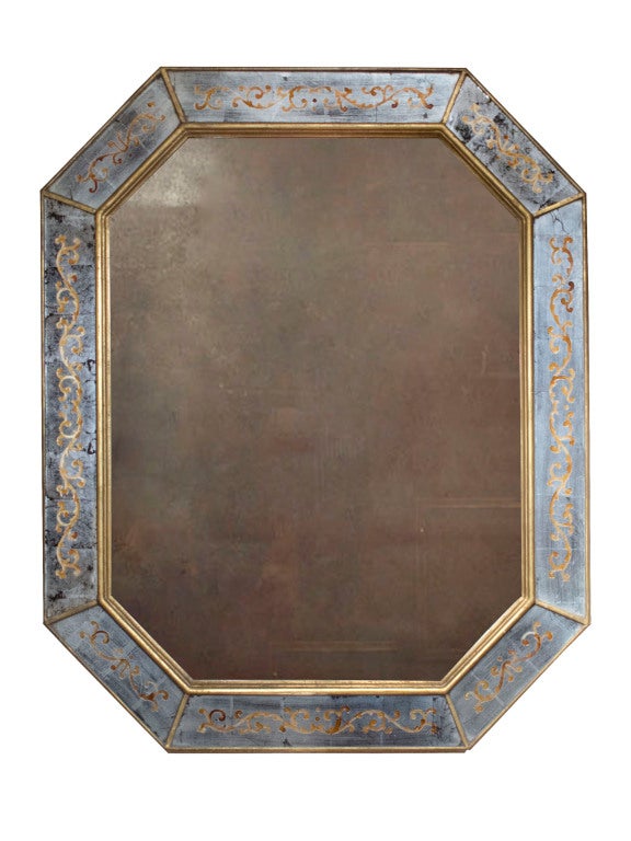 Jansen eglomise octagonal mirror. The central mirror plate surrounded by giltwood moldings framing eglomise panels of scrolling foliate designs in gold and silver gilt decoration.
 Maison Jansen was a Paris-based interior decoration office founded