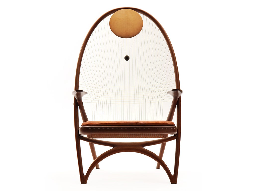 A rare easy chair designed by the architect Helge Vestergaard Jensen and executed by the cabinet-maker Peder Pedersen for the exhibition in 1955. The chair has distinct reminiscences of the Windsor chair though the modern lamination technique has