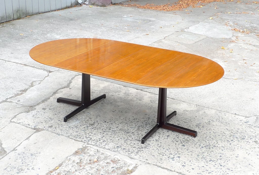 Edward Wormley, “Racetrack, “ table for Dunbar, circa 1960.
Elegant,sturdy dining table with what is perhaps the best finish we've ever been able to produce.
Detailed dimensions.
28”ht 50”diam 2X18” leaves for 86