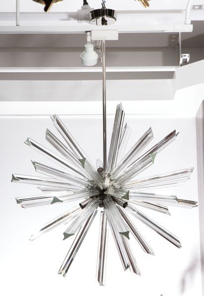 Fantastic sputnik chandelier with crystal rods and a polished nickel frame.