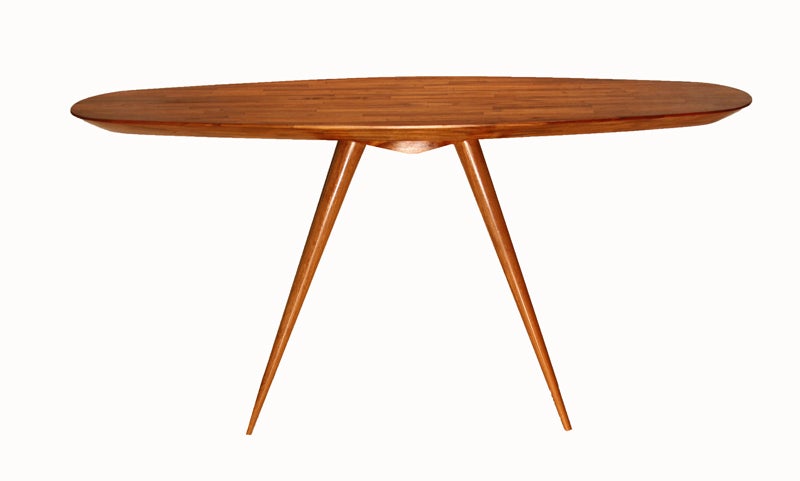 A Teka, or farm grown Brazilian teak, "Pé Palito" console table by Brazilian designer Tunico T., with solid Black Sucupira legs. The top is thick and rounded, is signed by the artist underneath, and there are four "toothpick"