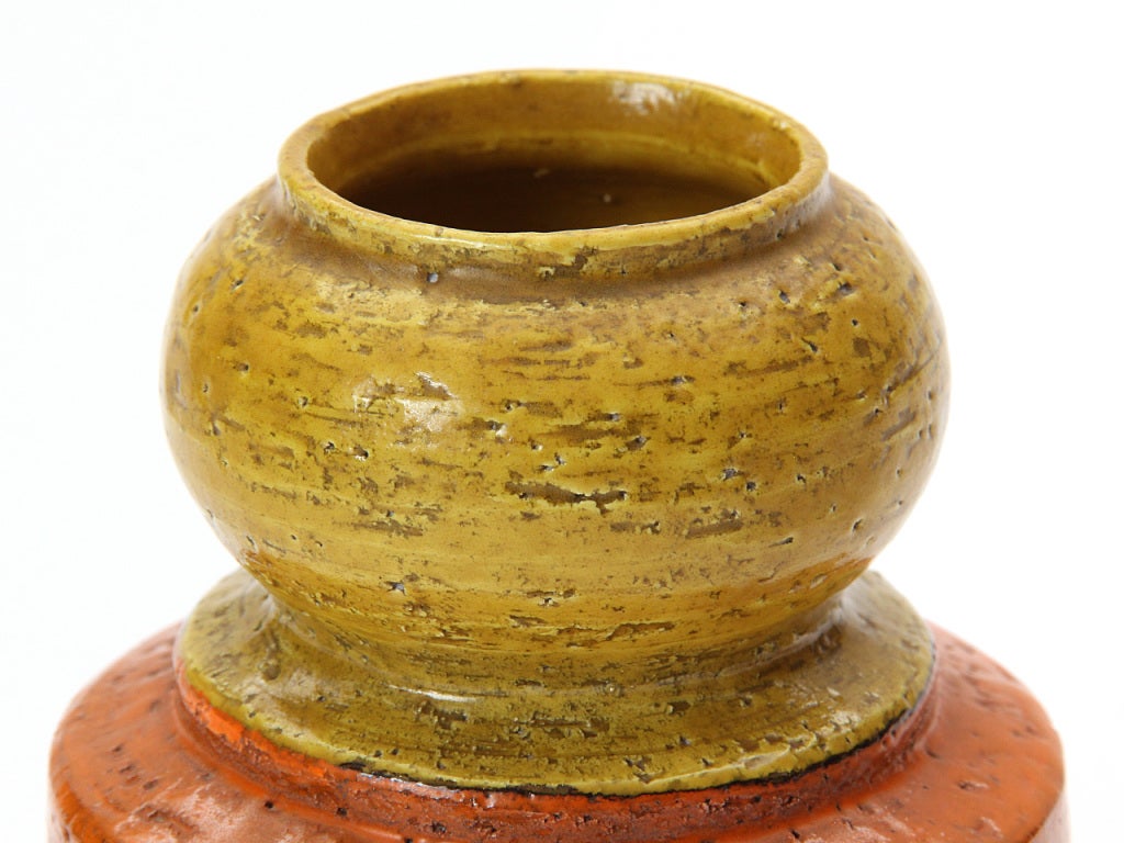 A yellow and orange vessel. Marked 