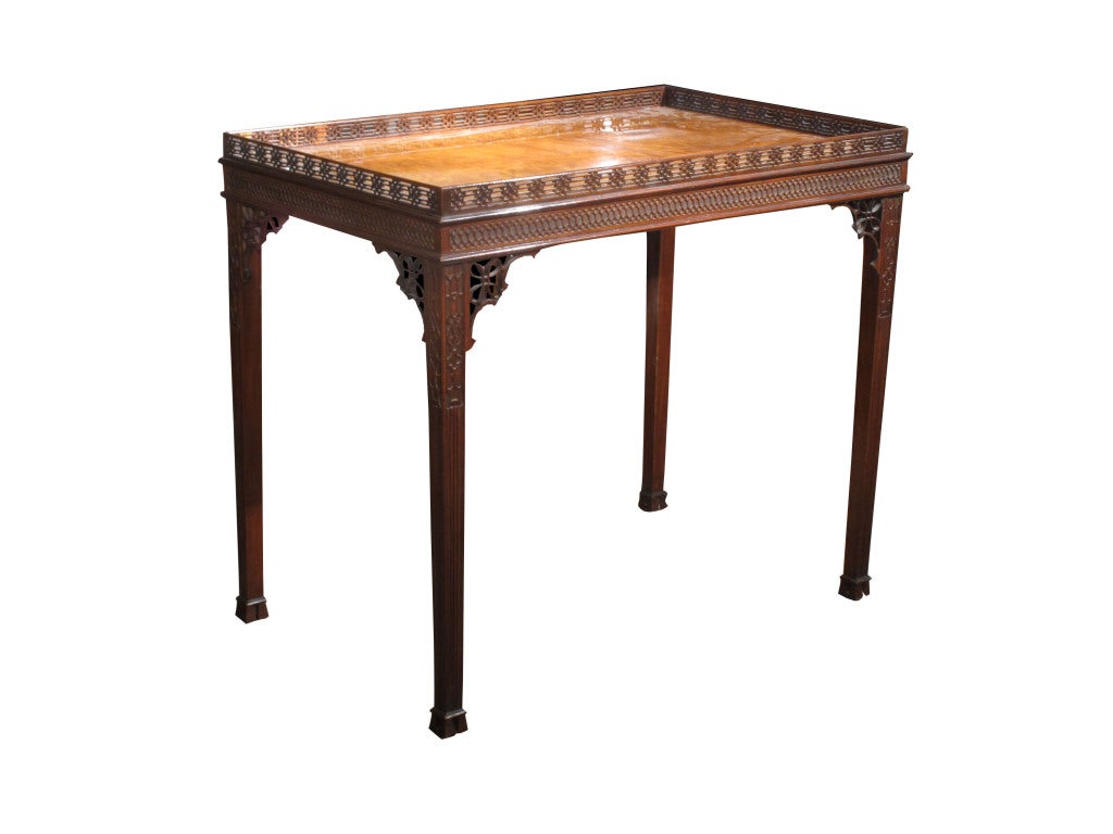George III mahogany tea table in the Chinese Chippendale taste (see his “Gentleman and Cabinet-Maker's Director”, published 1754). His Plate LX illustrates a related tea table, but it is interesting to note he calls them 