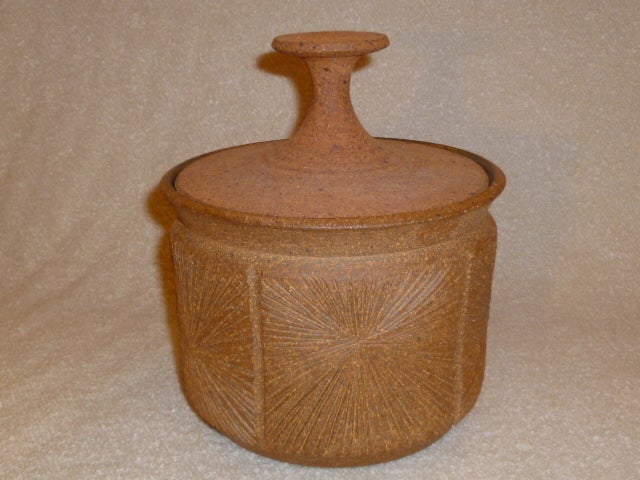 SOLD Created by noted California potter Robert Maxwell in collaboration with David Cressey for their rare, short-lived 70's Earthgender collection, this hand thrown stoneware lidded cache pot has the incised starburst pattern on five panels around
