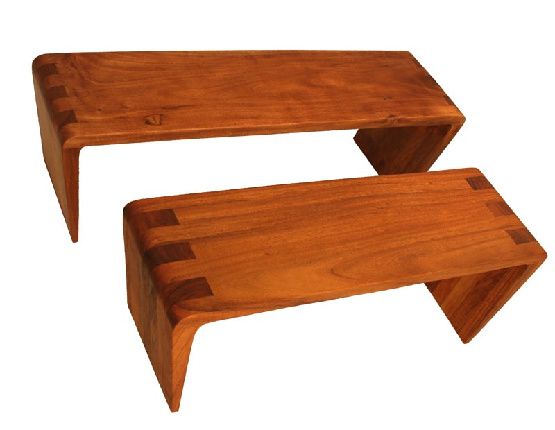 Two benches designed by Brazil's Tunico T. The larger is made of solid Eucalipto Citriodora or Eucalyptus and the smaller is made of solid Tamboril wood.  Both are part of the 
