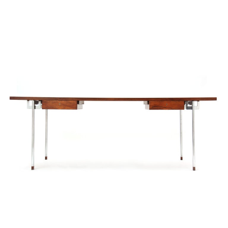 A rosewood two-drawer desk with satin-chrome steel legs and rosewood feet. Design by Hans J. Wegner, cabinetmaker Andreas Tuck