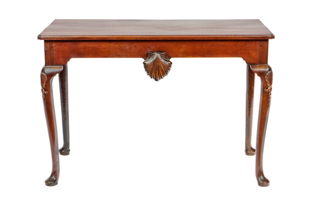 Irish Georgian mahogany console table with carved shell on center frieze.