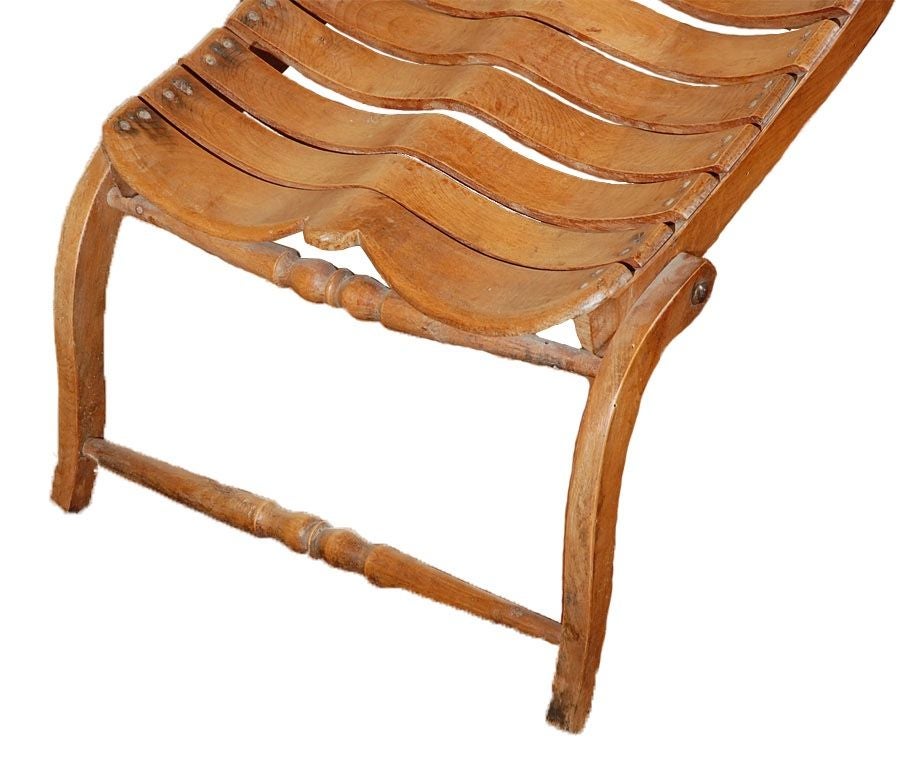 Vintage biomorphic French steamer lounge chaise, with an

astonishing 'sculptural spine' made of beechwood.  The design of this

biomorphic chaise without question preceded the Biomorphism movement that began in the 20th century with designers