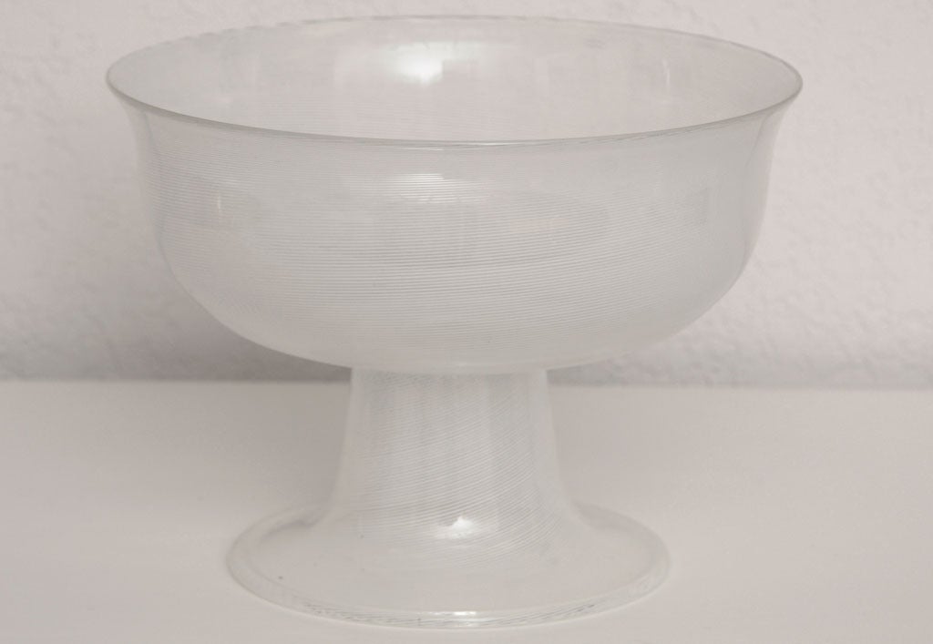 Stunning handblown footed bowl in a delicate white or clear stripe pattern. Signed Venini Italia '81. Reduced from $1,250.00.

Please feel free to contact us directly for a shipping quote or any additional questions by clicking on 