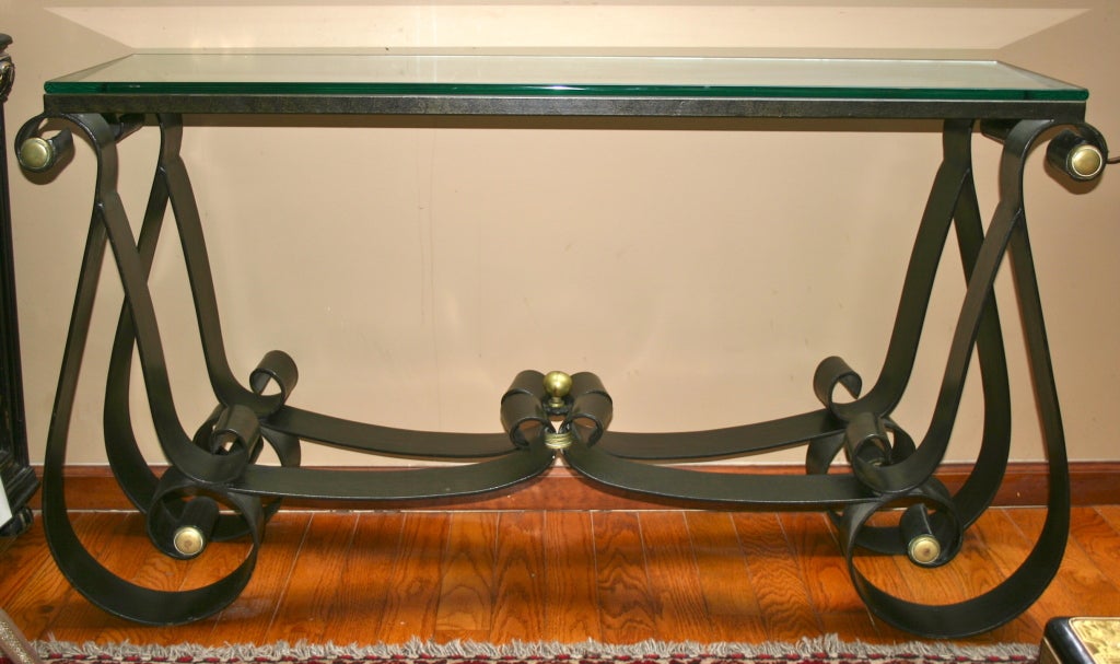 Pair of forged iron console tables with original glass tops. The iron with original patina. Scrolling motif bases, Italian, 1960s.
Measurements:
Height: 32