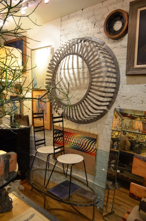 Oversized steel engine turbine cover with very unusual design and shape. Newly polished they would make interesting wall decoration, mirror or coffee table. Only one available.