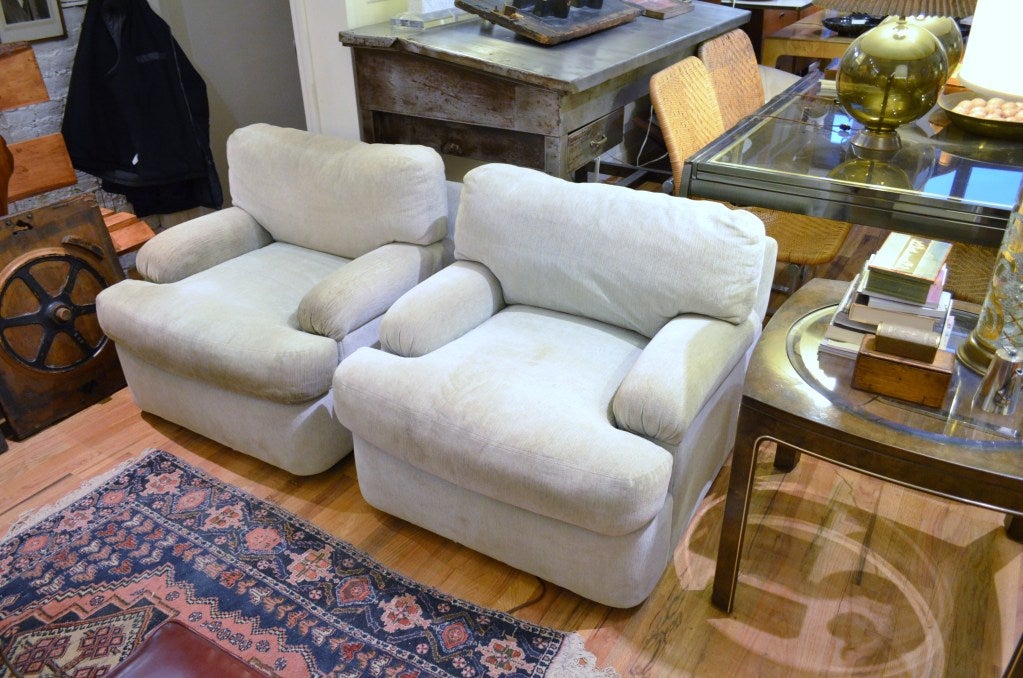 A pair of Directional swivel chairs and ottoman designed by Milo Baughman. The ottoman's measurements H 20 inches 24 x 33.
These are a great pair of hard to find square swivel chairs. The chairs and ottoman are in their original upholstery. They