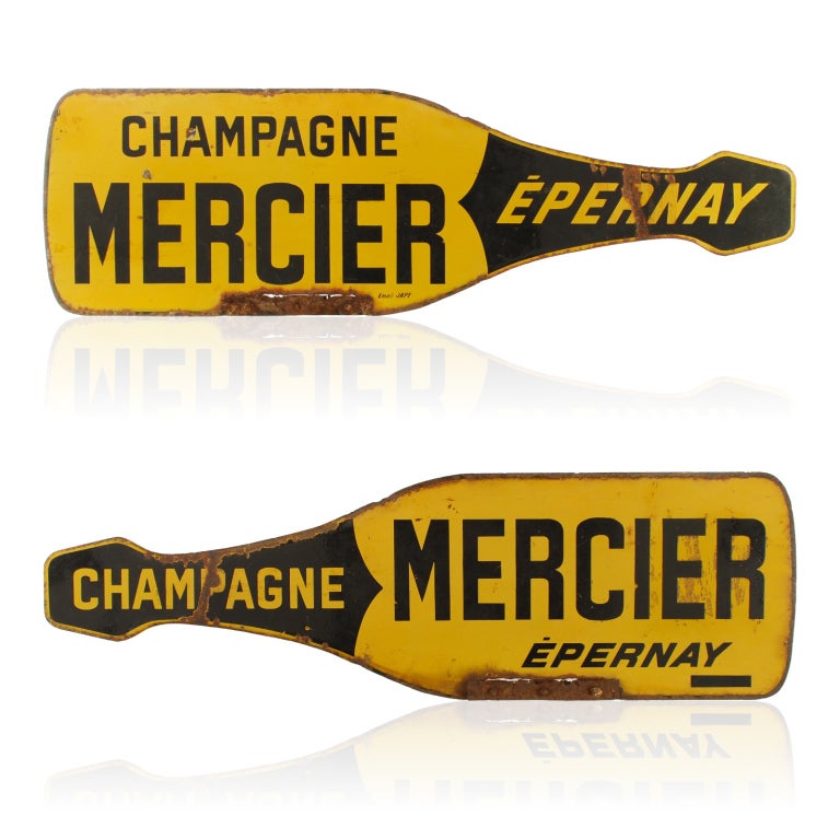 This wonderful double sided porcelain sign is a large bottle of Mercier Champagne from Epernay, France. This unique advertising sign most likely came from the top of one of their Citroen delivery trucks. This piece would be perfect for a Wine room