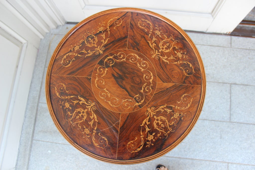 This unique and very elegant Ladies work table (sewing &knitting) has a beautiful circular top in bur walnut with a  gorgeous inlay of foliage and flowers in satinwood . Just under  the top is an adjustable basket with a padded interior which is
