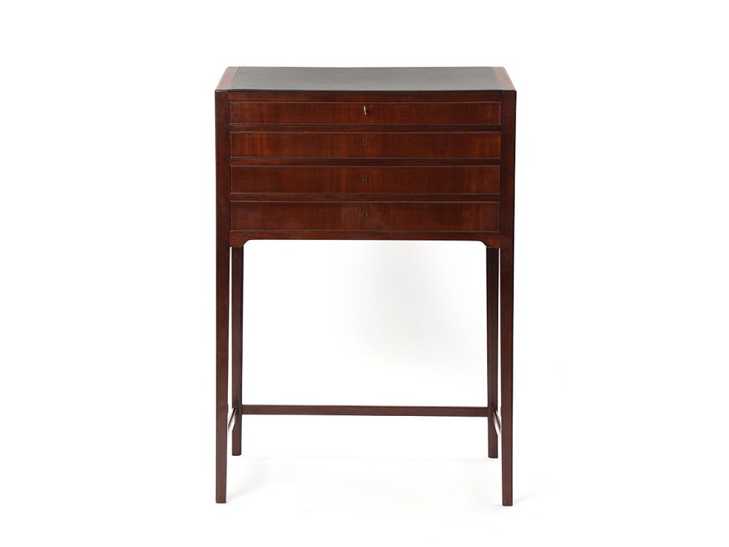 A rare upright Cuban mahogany podium secretary, with an angled black leather blotter over four drawers.