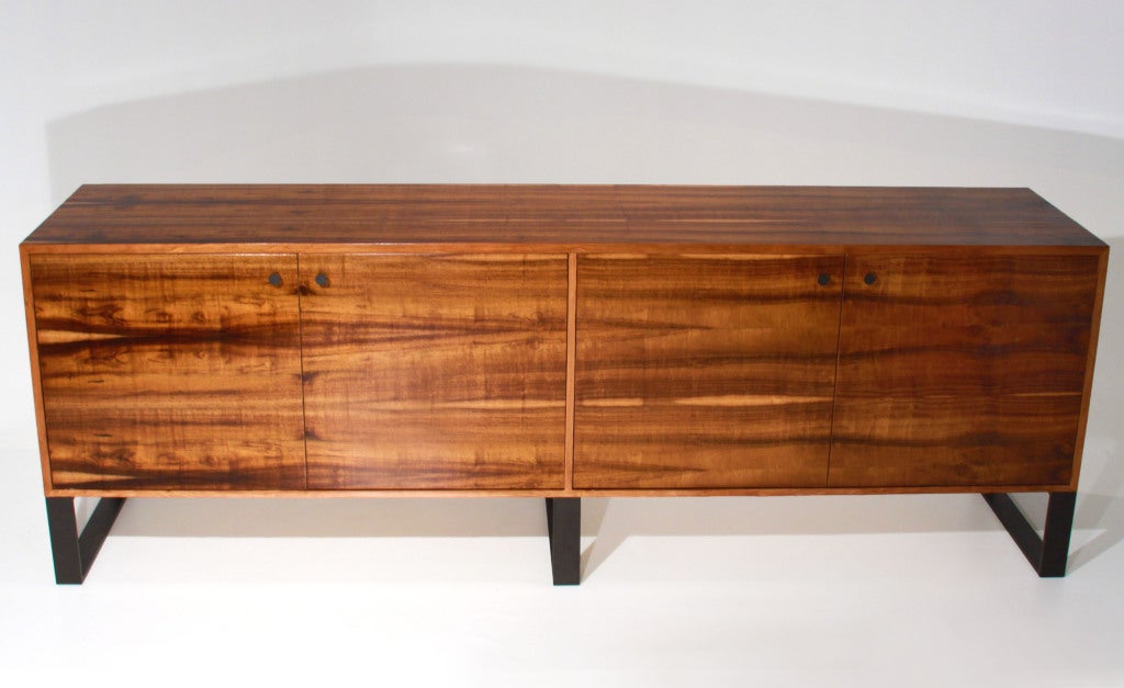 Large Imbuia credenza with Bronze coated legs and hardware by Thomas Hayes Studio. The Brazilian Imbuia has a beautiful sap grain throughout and the four doors open to ample storage space within.

This item is available for custom order and the