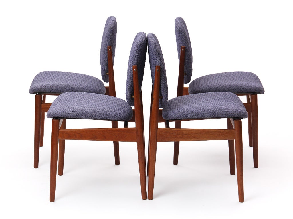 A dining chair having an exposed teak frame supporting wrapped molded seats and backs, the backs with a unique brass-hinged pivoting adjustment.
