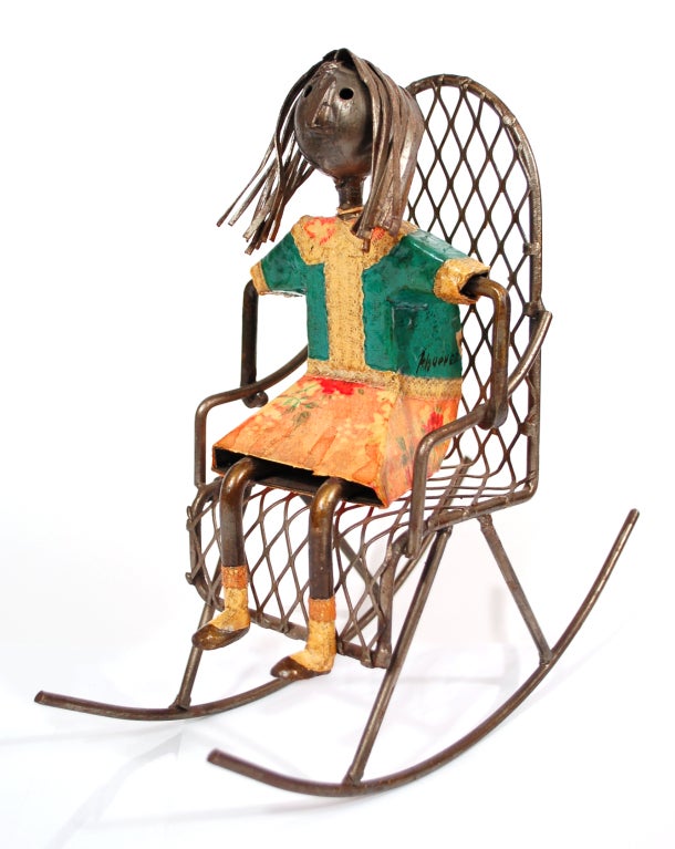 Original Manuel Felguerez sculpture of a girl sitting on a rocking chair. This is an authentic original piece signed by Felguerez.  Several authorized reproduction were sold by a member of his family.  However, the original signature serves to