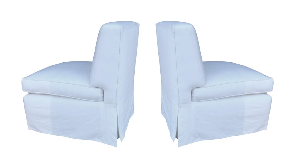 Pair of Billy Baldwin ribbed silk slipper chairs with down/feather-wrapped cushions, c. 1960
The chairs have been completely renovated, straps and springs restrung, the feather filling replaced and the legs reinforced.

Measurements:
30 1/2