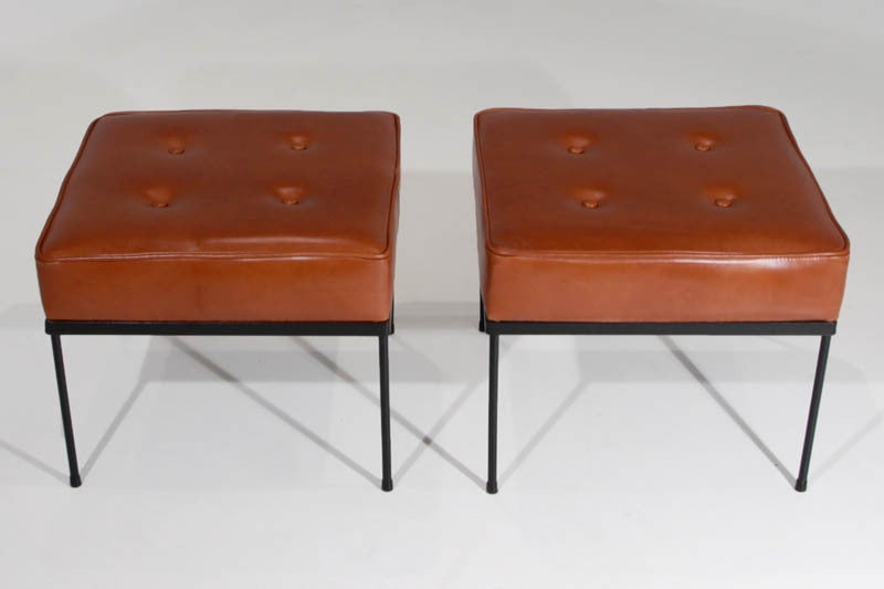 A pair of tufted, deep caramel leather ottomans or square stools with black steel bases by Paul McCobb. The cushion measures 4 inches in height.
Many pieces are stored in our warehouse, so please give us a call at (323) 463-4434 or email us at
