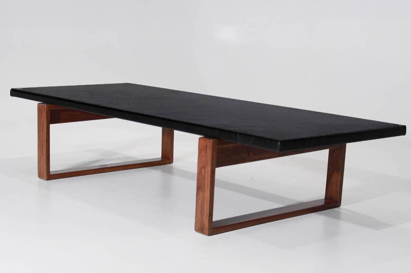 Rectangular leather wrapped coffee table with a vintage solid Walnut base.
 