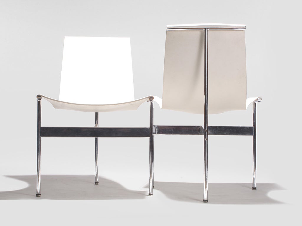 A “T” chair with chromed steel frames and the original white leather sling seat. 
