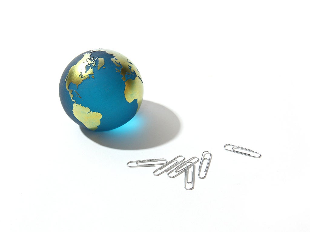 A glass paperweight globe signed by the artist 