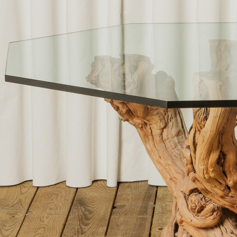 Large Cypress root dining table with unusual eye catching base. Would make a great focus piece in any entrance.
New smoked grey glass hexagon shape top