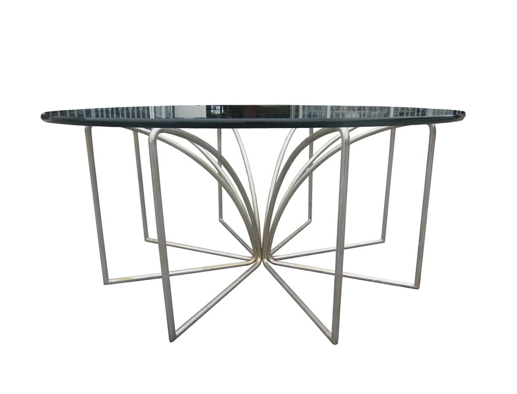 Amazing Kipp Stewart coffee table. The delicate lines of this table allows for its placement in any decor. Simple in its execution, complex in its design. Topped with a 3/8 inch glass, this table is very modern. 
Overall Dimensions: 16