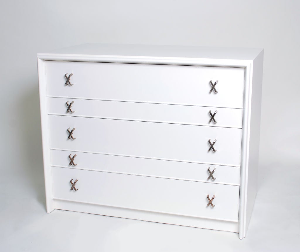 Five drawer dresser / chest of drawers designed by Paul Frankl for Johnson Furniture Co. X-shaped metal pulls, one drawer with separators.

*Notes: There is no sales tax on this item if it is being shipped out of the state of Florida