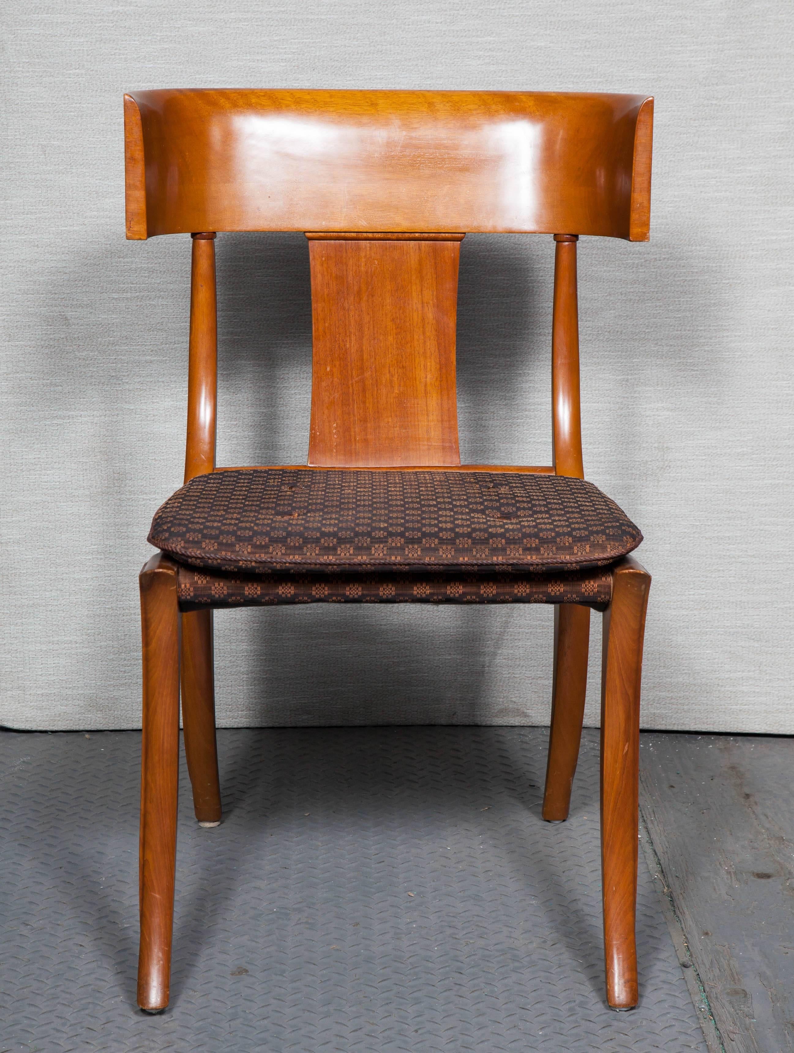 Beautiful set of eight wooden Klismos chairs in the style of T. H. Robsjohn-Gibbings. Upholstered in horsehair.