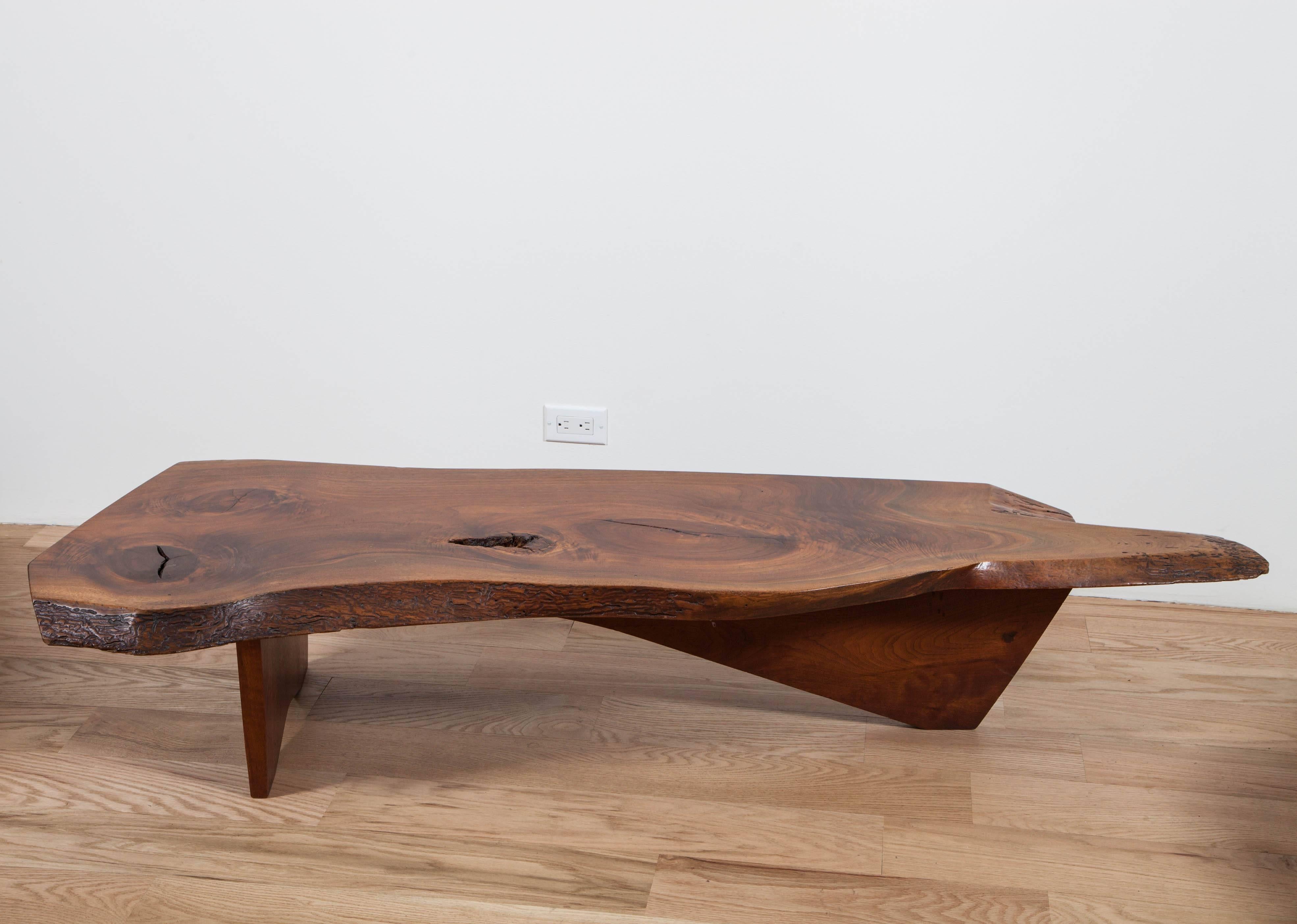 George Nakashima, 1965. 
American black walnut, double free edge solid top with highly figured grain.

Signed with original clients name
with authenticity document from Nakashima Woodworker.