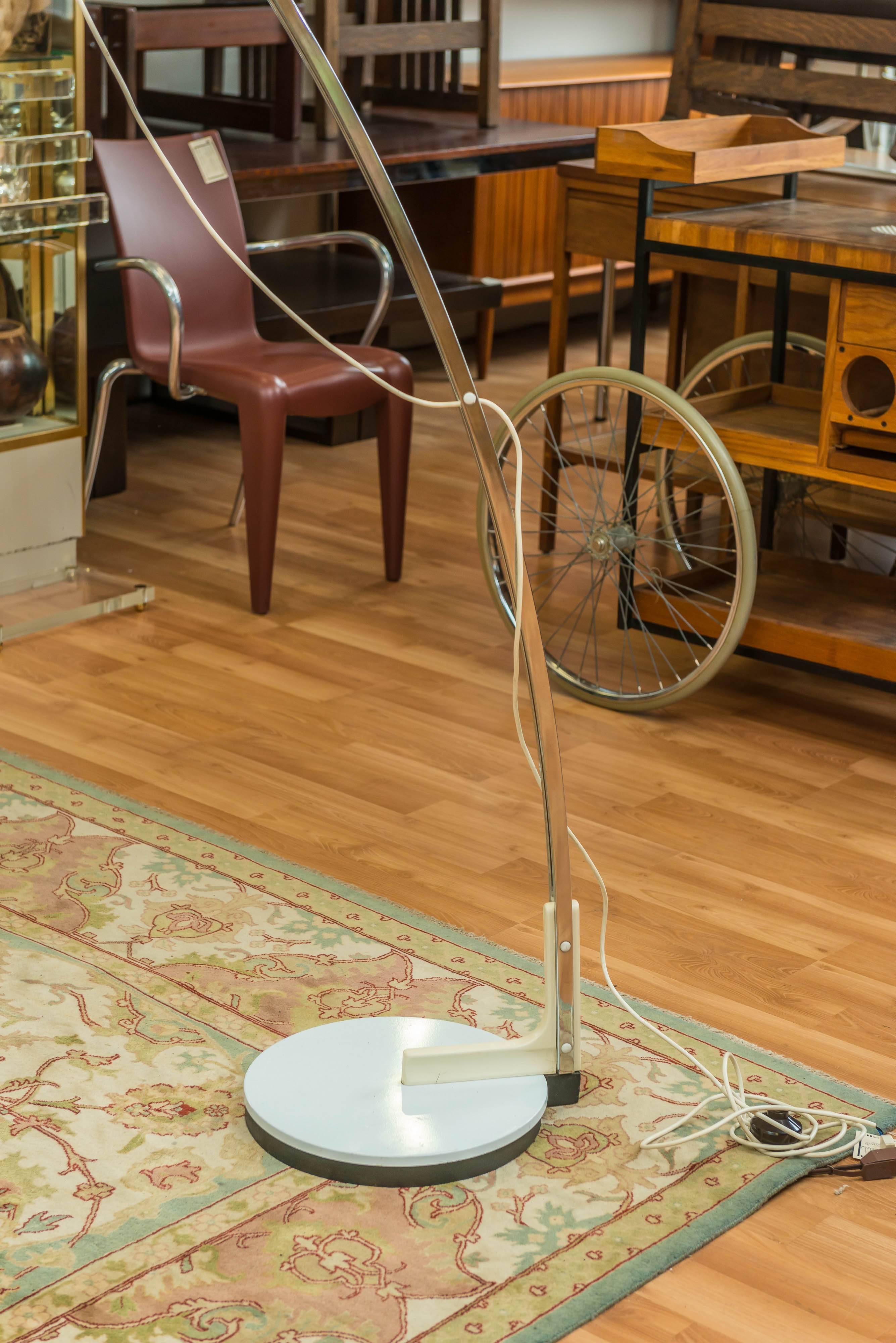 Large Goffredo Reggiani Italian arc floor lamp (stamped Reggiani on the underside base), Extendable/adjustable aluminum arm (arm in about 82in, out about 112in) with it's original perspex shade at it's end. Base is cast iron with painted cover.