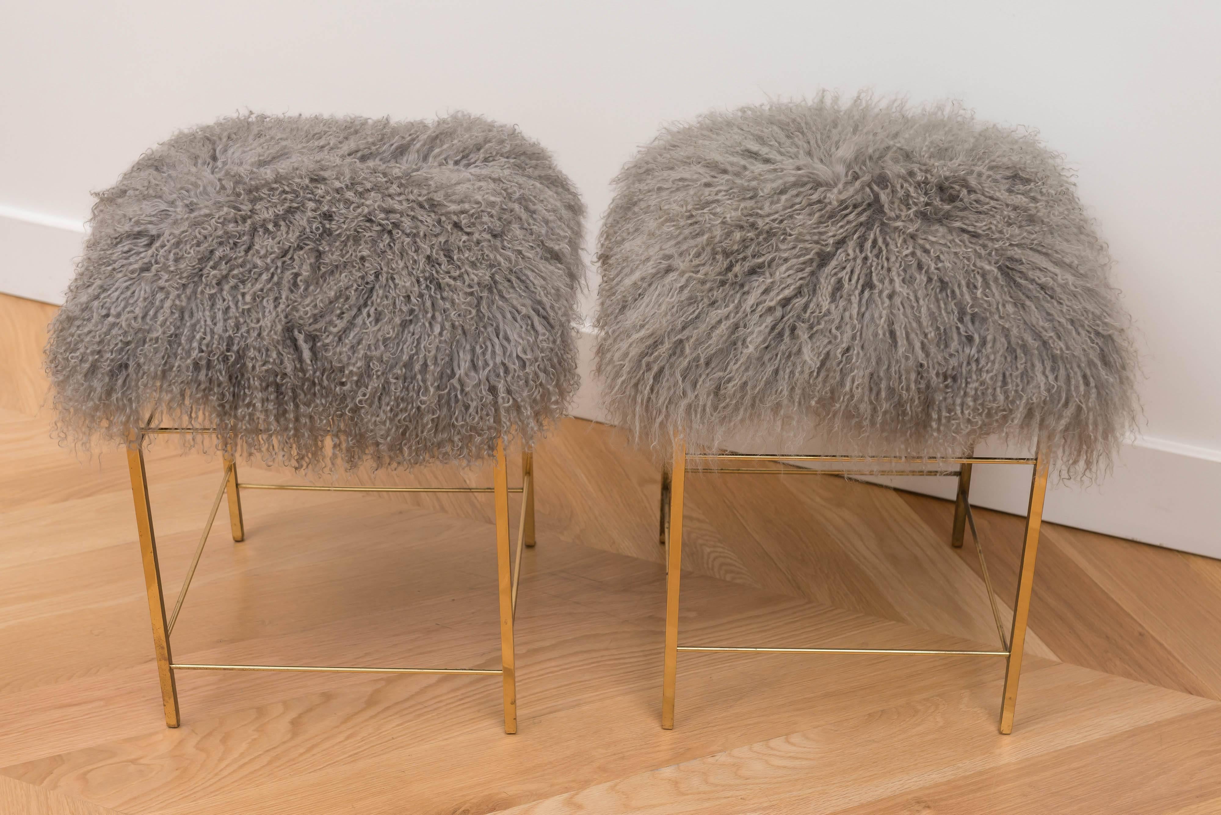 Fun pair of Italian brass stools with grey Mongolian wool seats.