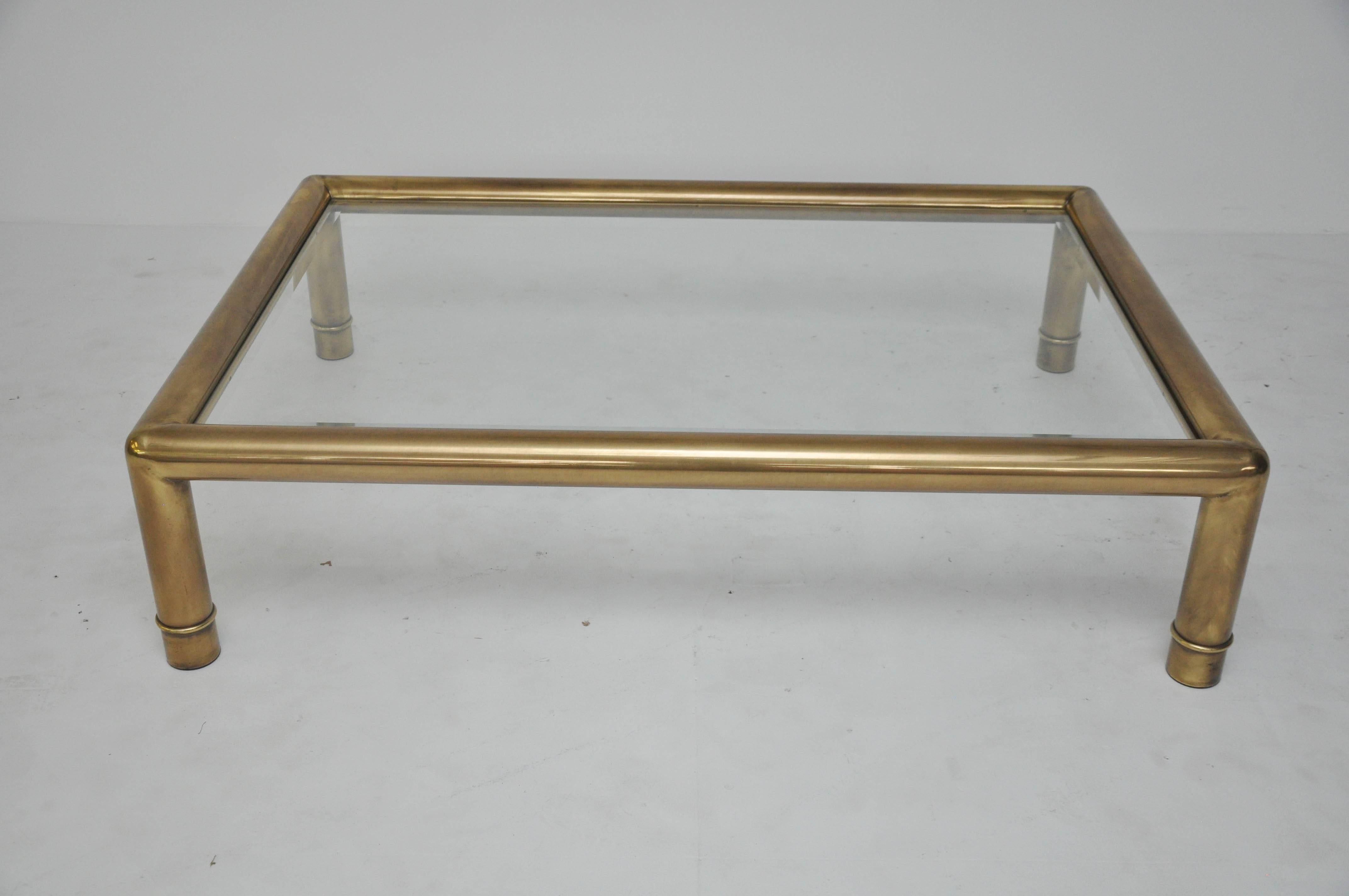 Brass frame coffee table with glass top by Mastercraft.