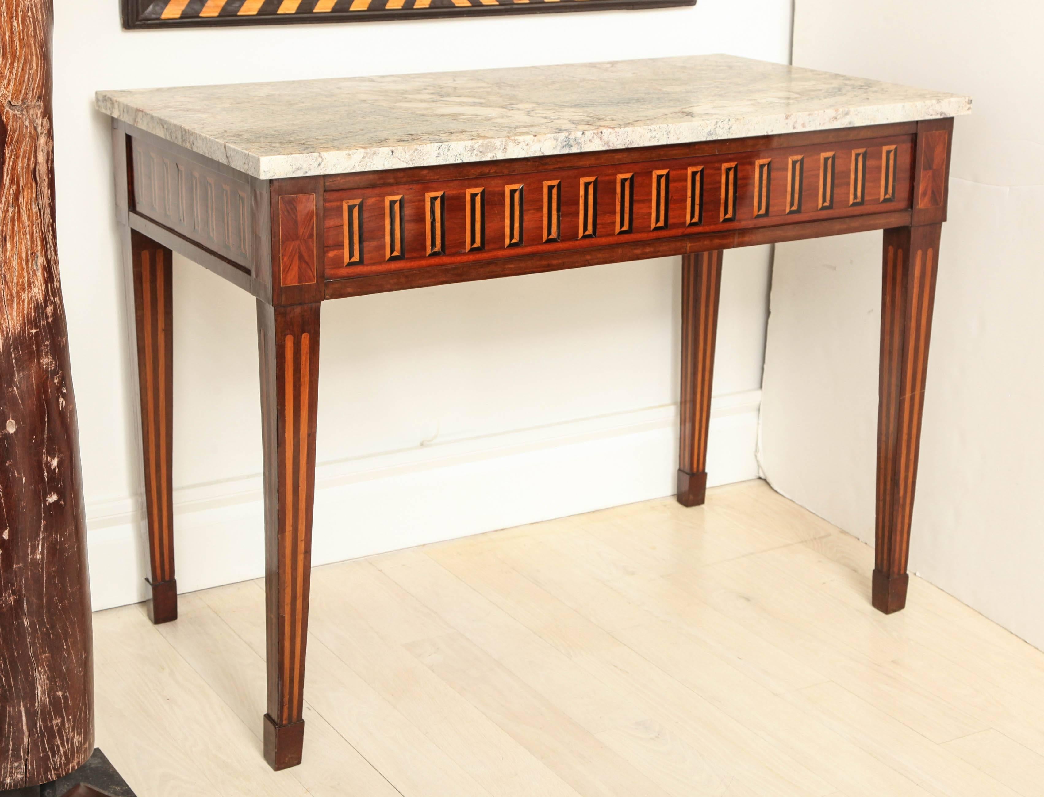 Empire console table with inlaid front apron of ebony and rosewood, with tapered fluted legs and Typhoon Bordeaux marble top, circa 1810.


Available to see in our NYC Showroom 
BK Antiques
306 East 61st St. 2nd fl.
New York, NY 10065