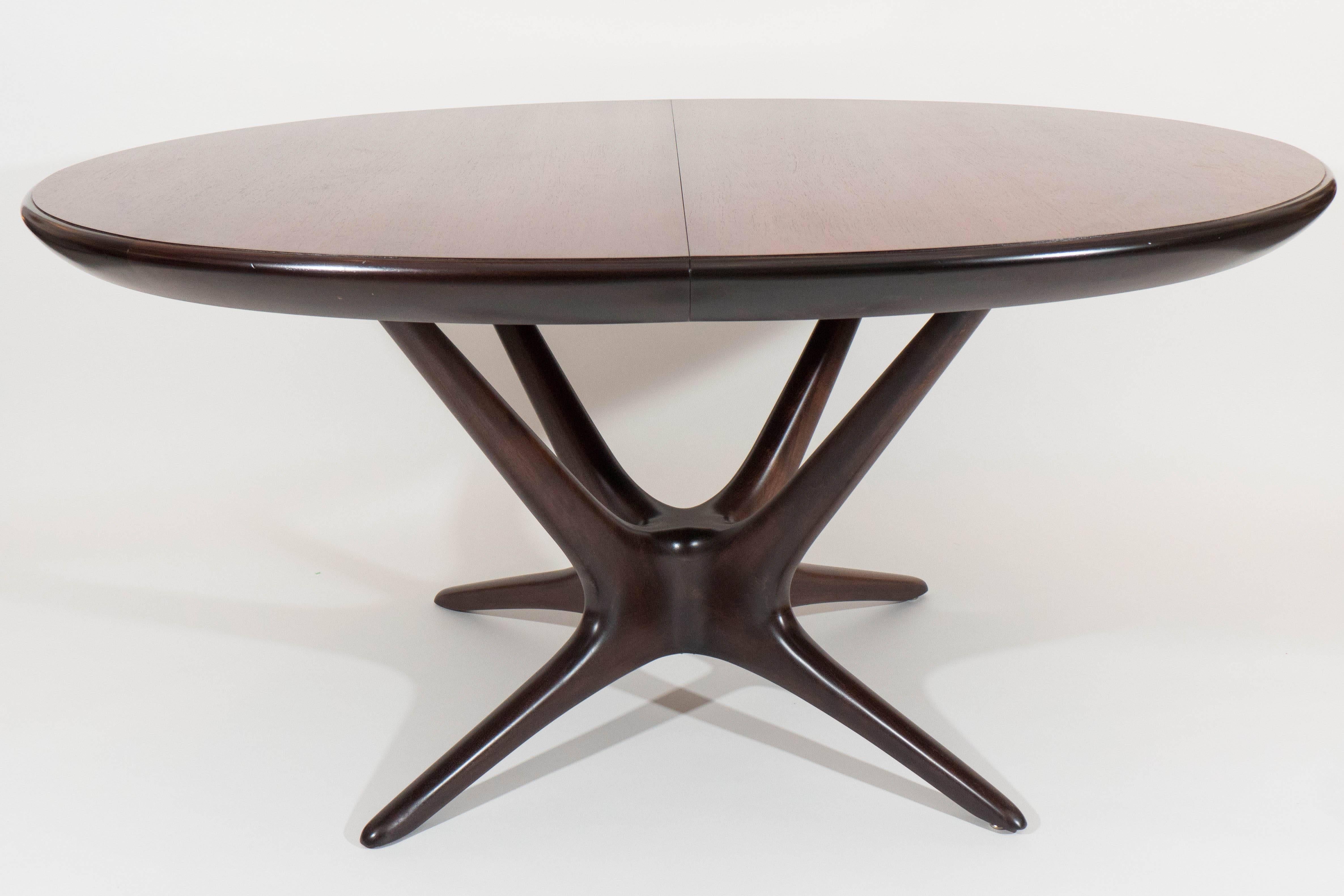 Designed by Vladimir Kagan for Kagan-Dreyfuss, this table is rare for it's size but possesses the signature organic form that has made Kagan an icon of Mid-Century design. The indicated measurements do not include the two signed leaves that extend